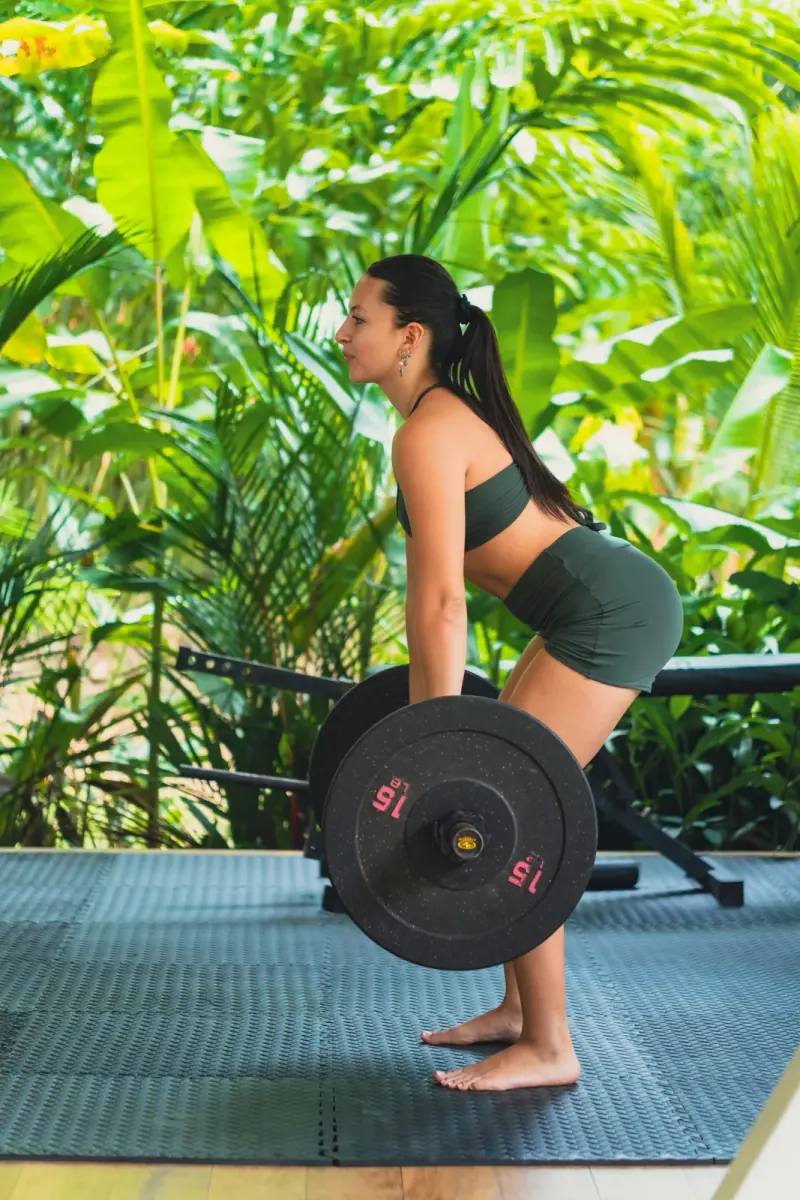 Woman lifting weights at the gym